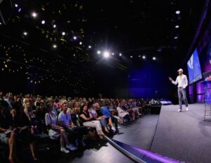 Nick Mennell speaking at MindValley Event